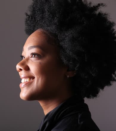 Facial aesthetics: Smiling woman in side profile with defined jawline